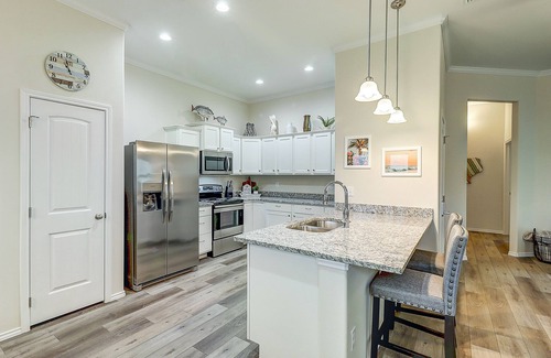 Rockport House | Placid home with balcony, patio, gas grill, washer/dryer, & pool - golf nearby