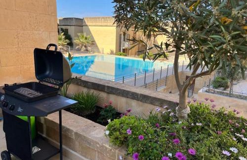 Ghajnsielem Apartment | Poolside Luxury Apartment with Patio 11A3S