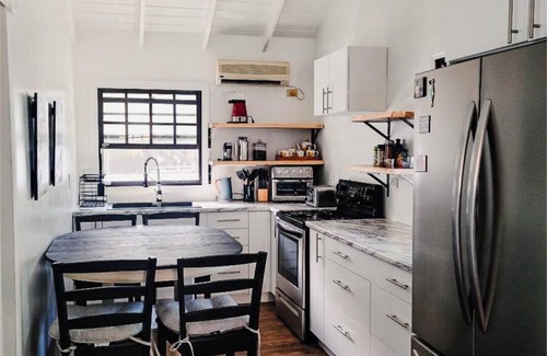 Cockburn Town Villa | Potcake Villa — Stay with Purpose: Support Animal Welfare