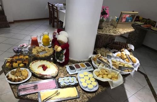 Centro Cabin | Pousada Rota do Sol Bombinhas suítes com café e sem limpeza diaria