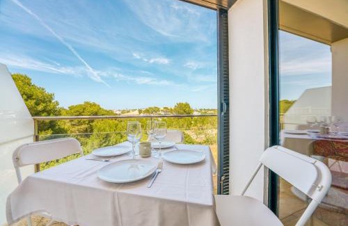 Son Carrio Apartment | PRECIOSO DUPLEX EN CALA SANTANDRIA CON PISCINA Y WIFI