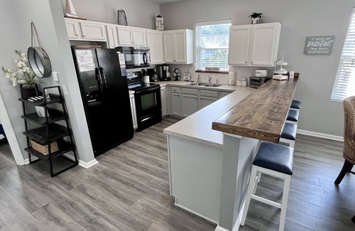 North Myrtle Beach Condo | Premier Golf Location - Barefoot Resort! Family/dog friendly - 2 pools/beach!