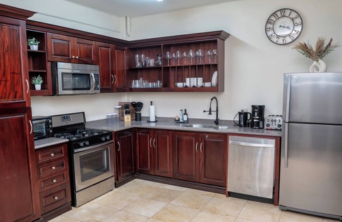 Newtown Apartment | Prime Location + Rooftop Access + City Views + Queens Park Savannah + Walkable