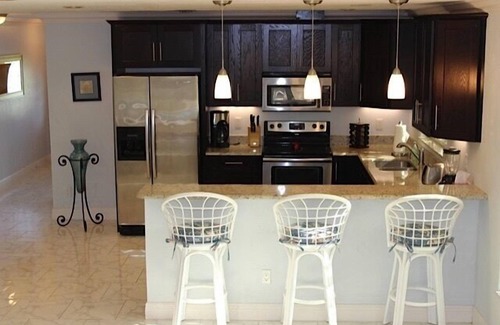 Naples Park House | Private, fenced-in pool, Morning Coffee on the porch and easy mile to the beach.