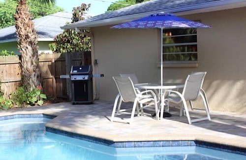 Naples Park House | Private, fenced-in pool, Morning Coffee on the porch and easy mile to the beach.
