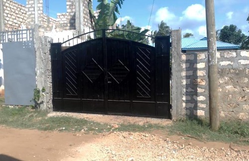 Manyimbo House | Private Holiday Home in Mtwapa, A back view of Coconut trees!