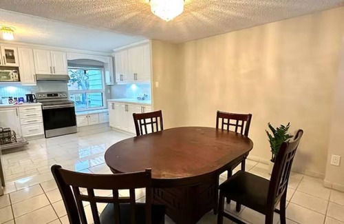 Mississauga Valleys House | Private home with large bedroom and spacious common areas with patio.
