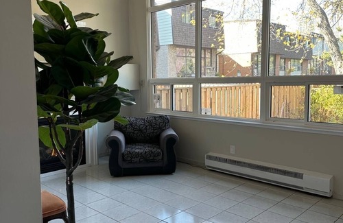Mississauga Valleys House | Private home with large bedroom and spacious common areas with patio.