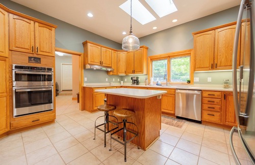 Dublin House | Private lakefront home with dock, forest views, balconies, game room, and cozy indoor charm