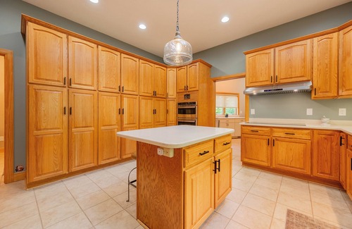 Dublin House | Private lakefront home with dock, forest views, balconies, game room, and cozy indoor charm