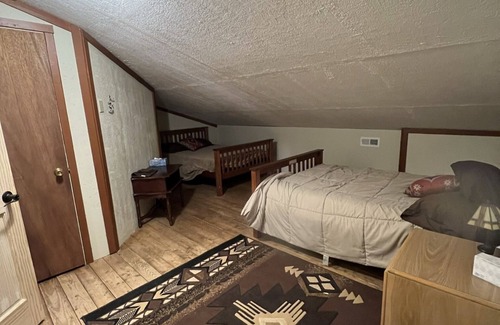 Sundance House | Private Queen Room #1 at The Lodge at Devils Tower