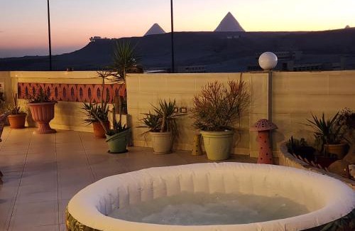 Pyramids Gardens Apartment | private rooftop with hot jacuzzi and pyramids view