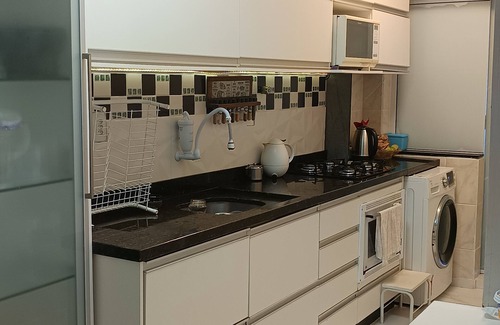 Itapema Apartment | Private room with air conditioning, TV, minibar. In a beautiful apartment, 250m from the beach. shared
