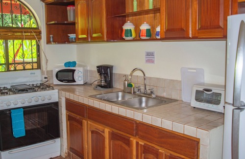 Dominical Apartment | Private suite 102 with beautiful gardens, shared pool and BBQ area!