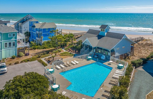 Village of Stump Sound House | Quaint beachfront cottage with Ping-Pong table, decks, community pool & views