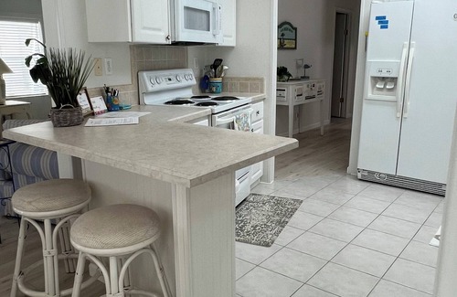 Saint James City House | Quiet, clean & comfy 2 bed-2bath with 8000lb boat lift and large screened lanai