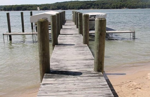 East Jordan Cottage | Rare Sandy Beach Lake Charlevoix Front Home -- Spacious Beach, Fishing, Shade
