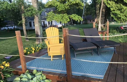 East Jordan Cottage | Rare Sandy Beach Lake Charlevoix Front Home -- Spacious Beach, Fishing, Shade