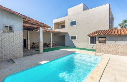 Cabo Frio House | Refúgio Tropical Casa de Praia com Piscina Climatizada e 4 Suítes e garagem 3 carros, 800 mtrs da praia internet 700 mbps, condomínio privado com pista de skate , quadra de futevôlei , campos e quadras de futebol!