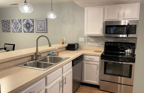 Village of Four Seasons Condo | Regatta Bay 488-1B - Modern Great Corner Unit Condo in Regatta Bay Complex.