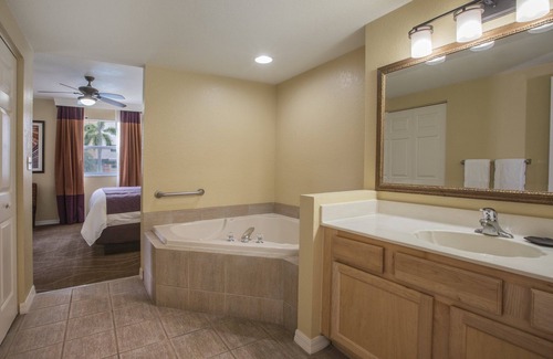 Survey Creek Resort | Relax at our Palm Tree secluded Resort with a poolside bar and waterslide