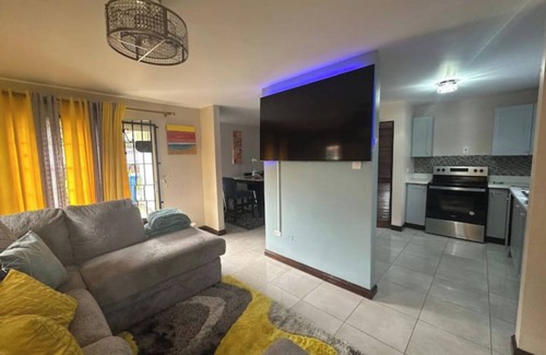 Portmore Villa | Relax by the pool with the sounds of waves and enjoy ocean and mountains views