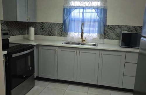 Portmore Villa | Relax by the pool with the sounds of waves and enjoy ocean and mountains views