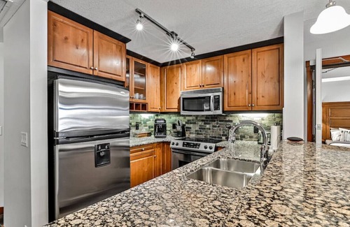 Canmore Apartment | Relax & Explore: Mountain Views, Heated Pool & Dog-Friendly Condo