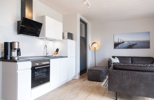 Dornum Apartment | "Relax in the charming Gulfhof Dreybült vacation apartment in Neßmersiel!"