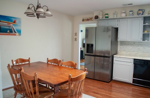 Durants Neck Cottage | Relax on the Little River with a pool, fishing, and river access.