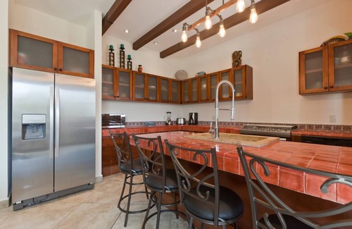 Villa Juarez Condo | Relax to the sound of a waterfall right outside your window!