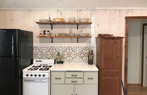 Ludington Cottage | Remodeled lakefront cottage w/marina, firepit, swimming area.