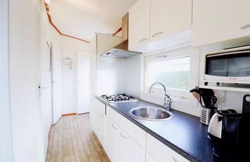 Hollum Ski Chalet | Restful Dune Chalet in Hollum between Golf course and Beach