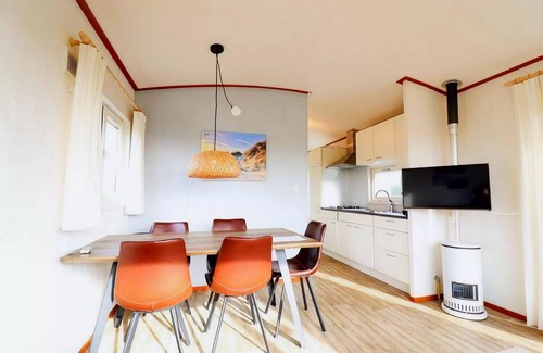 Hollum Ski Chalet | Restful Dune Chalet in Hollum between Golf course and Beach