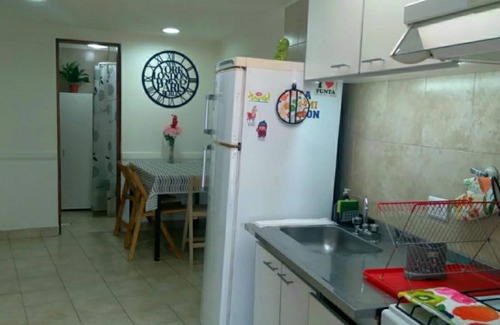 Province of Tierra del Fuego Apartment | Retreat to this haven along Route 3, with a sunlit ambiance and garden view.