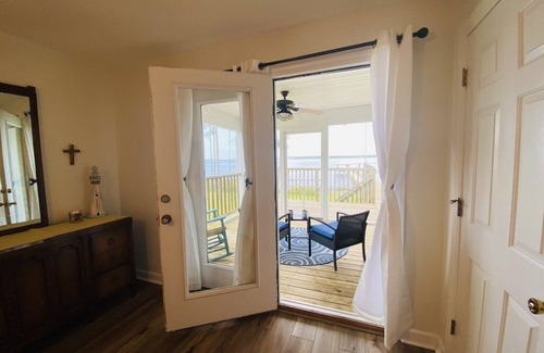 Hobucken House | Riverfront property with dock and ramp. Dolphins, fish, boat, swim & more