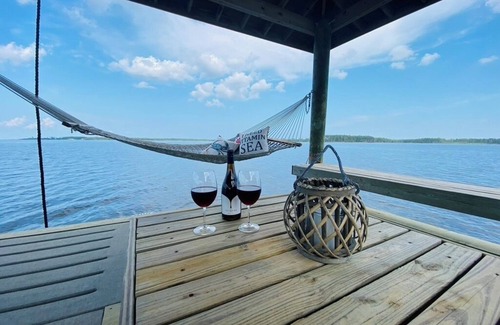 Hobucken House | Riverfront property with dock and ramp. Dolphins, fish, boat, swim & more