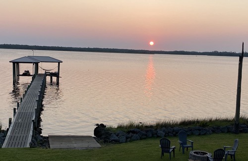 Hobucken House | Riverfront property with dock and ramp. Dolphins, fish, boat, swim & more