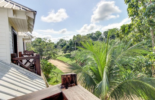 Bullet Tree Falls Apartment | Riverfront Suite with Balcony, WiFi, AC, Infinity Pool & Forest View