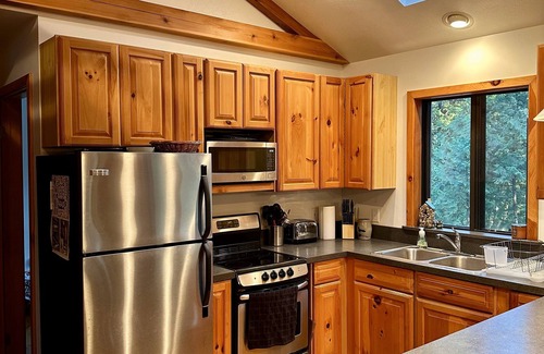 Rapid City Cabin | Riverside Cabin Near Torch Lake – Kayaks Included!