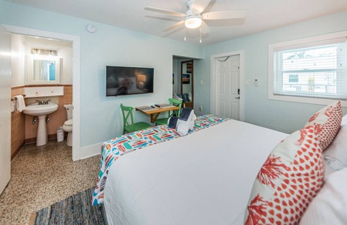 Sunset Beach Hotel | Room 10 · Renovated Boutique Hotel room with a Pool and dock