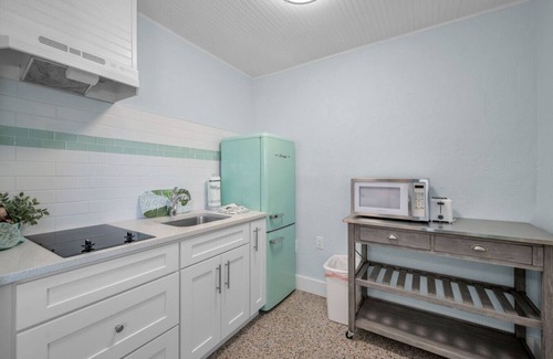 Sunset Beach Hotel | Room 10 · Renovated Boutique Hotel room with a Pool and dock