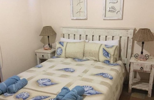 St. Helena Bay House | Rusbiki 8 guests · 3 bedrooms · 6 beds · 2.5 baths