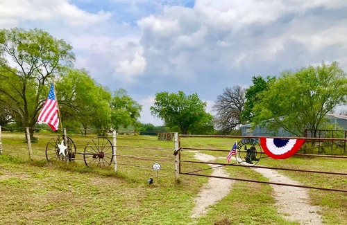 Gustine Cabin | Rustic cabin with peaceful view of windmill, pond and great sunsets. Gated.