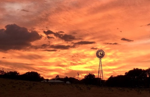 Gustine Cabin | Rustic cabin with peaceful view of windmill, pond and great sunsets. Gated.
