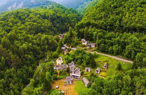 Cerentino House | Rustic house surrounded by greenery