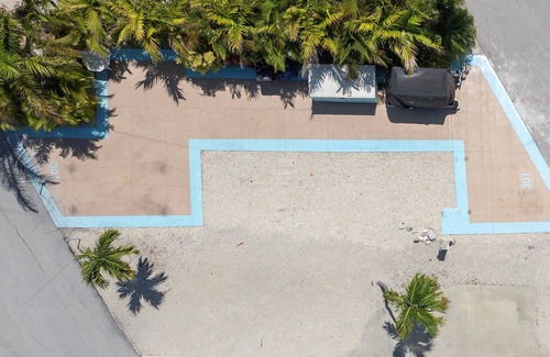 Cudjoe Key RV Rental | RV Lot 301 Venture Out, Pull-through Lot near the Ocean and Pool - Golf cart friendly!