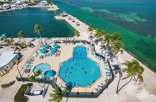 Cudjoe Key RV Rental | RV Lot 301 Venture Out, Pull-through Lot near the Ocean and Pool - Golf cart friendly!