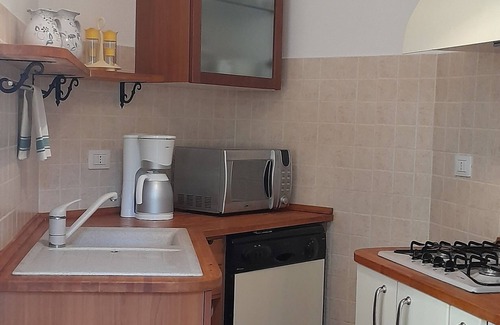 La Caletta Apartment | Sa Calitta apartment, central area with large veranda 300 mt from the beach