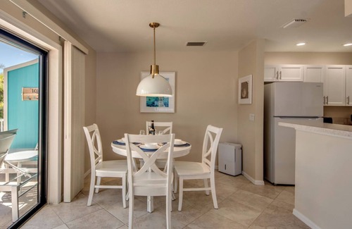 South Island House | Sand Dollar #3 - Upstairs Apt with Shared Pool on Canal by the Beach!